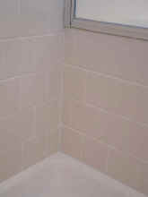 Shower after - tile replaced and re-grouted