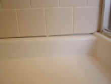 Shower Pan -before - Wide grout joint at bottom of shower pan.�